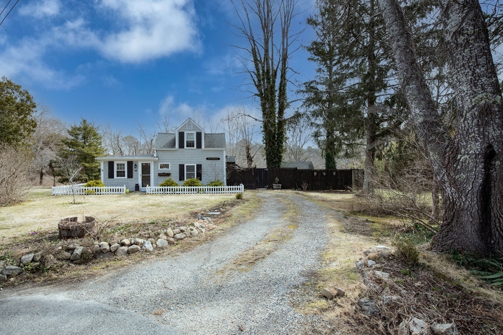 36 Lovell's Lane Mashpee, MA 02649 - Photo 2 of 23 a front view of a house with a yard