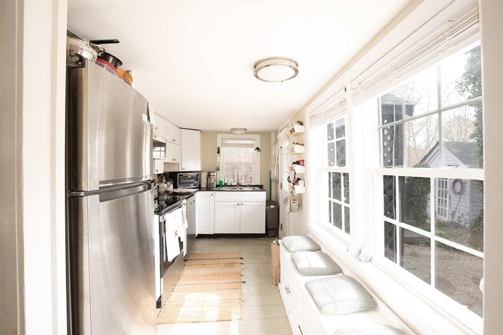 36 Lovell's Lane Mashpee, MA 02649 - Photo 8 of 23 a large white room with a large window and white walls