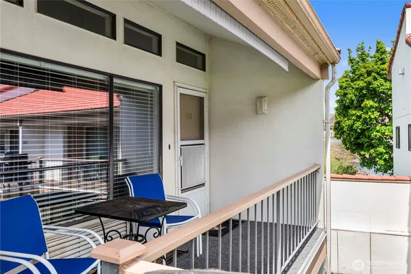 a view of balcony with furniture
