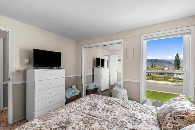 a bedroom with a bed and closet