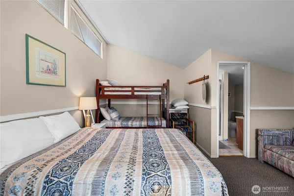 a bedroom with bed and window