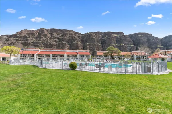 a view of a playground with a garden