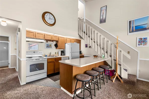 a kitchen with a table and chairs