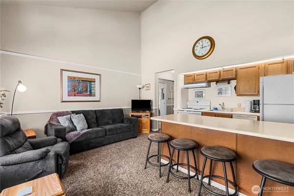 a living room with furniture and a table