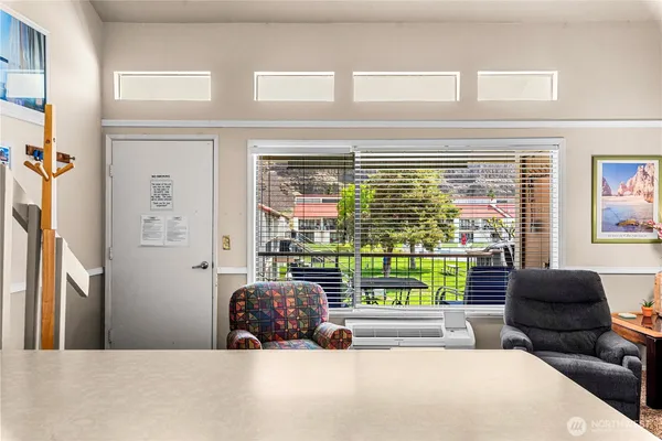 a view of a living room and a balcony