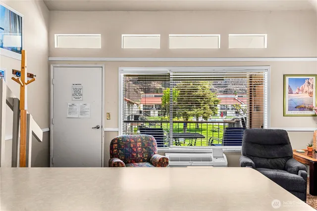 a view of a living room and a balcony