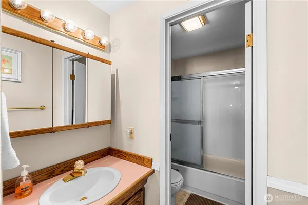 a bathroom with a sink and mirror