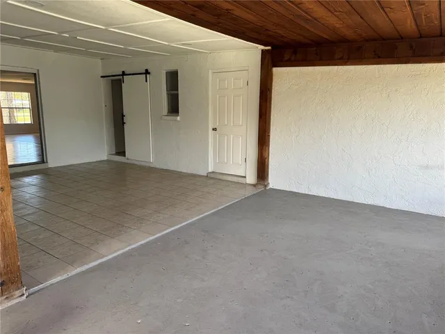 a view of a room with a large window