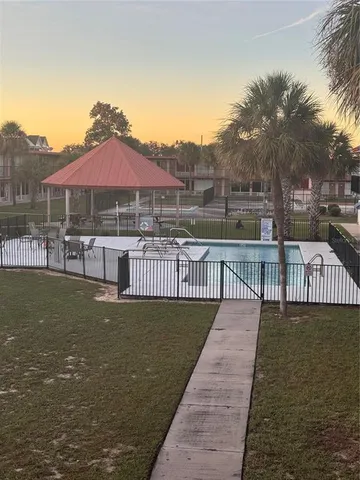 a view of a swimming pool with a patio