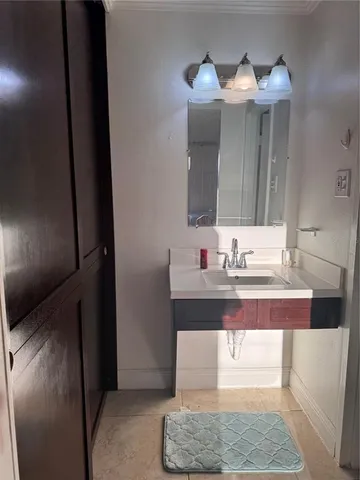 a bathroom with a sink and a mirror