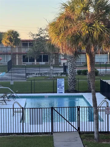 a view of a deck with a wooden fence