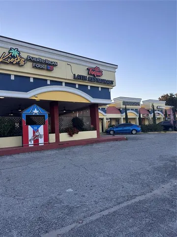 a view of a car park in front of a building