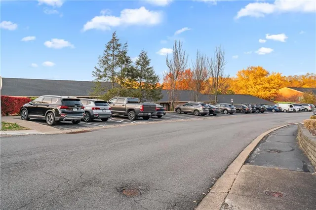a view of a city street with cars
