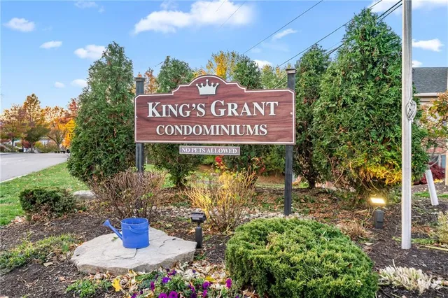 a sign that is on a brick wall