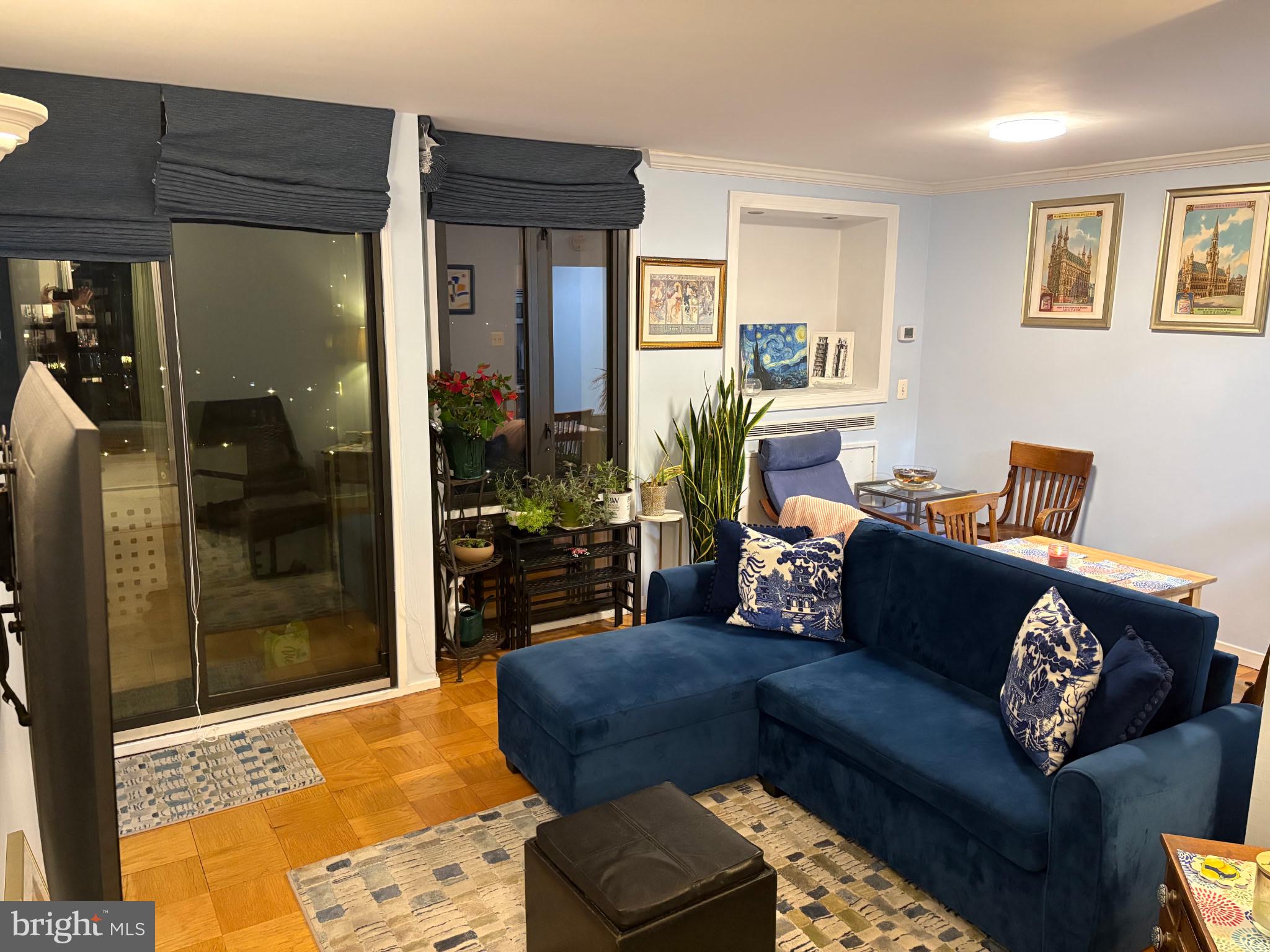 490 M Street Southwest, Unit W608 Washington, DC 20024 - Photo 6 of 12 a living room with furniture and a glass door