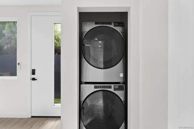 a close view of a utility room with washer and dryer
