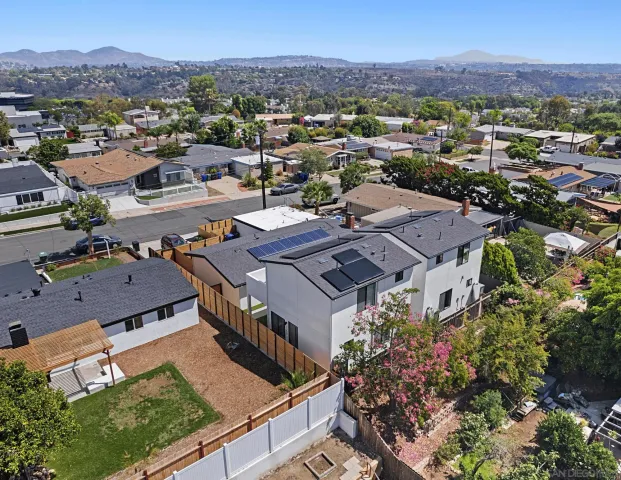 an aerial view of residential houses and outdoor space
