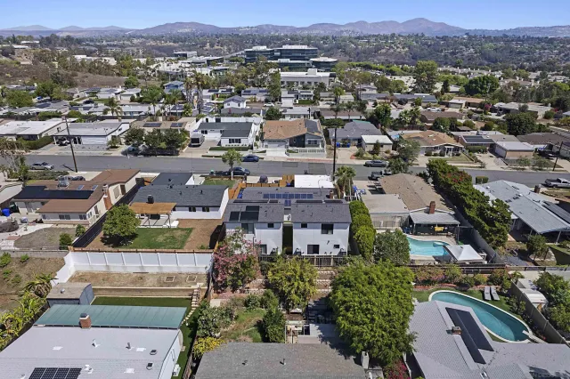 an aerial view of a city with lots of residential buildings