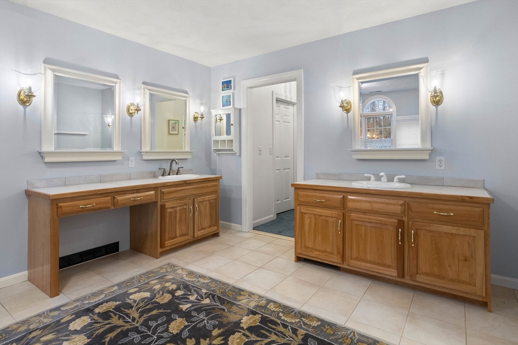 3 Woodland Road Boxford, MA 01921 - Photo 11 of 37 a spacious bathroom with a double vanity sink a mirror and a