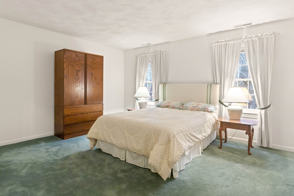 3 Woodland Road Boxford, MA 01921 - Photo 12 of 37 a bedroom with a bed and a table