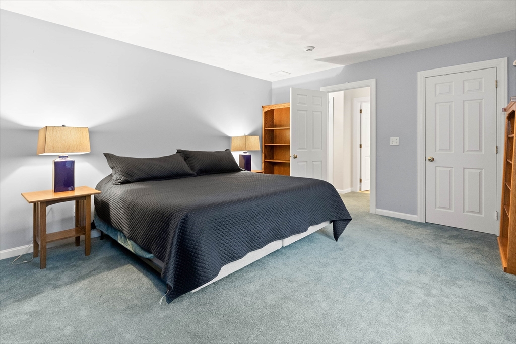 3 Woodland Road Boxford, MA 01921 - Photo 14 of 37 a bedroom with a bed and a cabinets