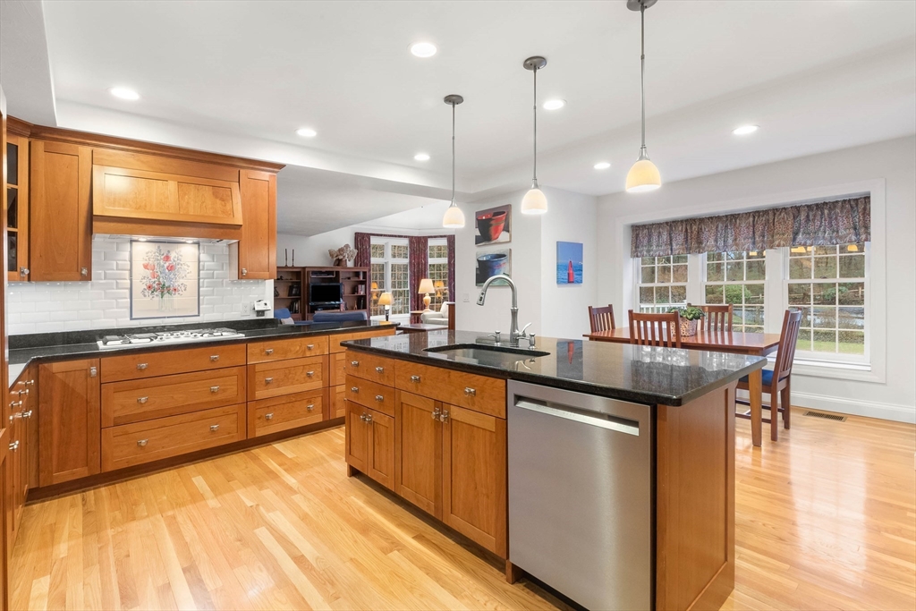 3 Woodland Road Boxford, MA 01921 - Photo 24 of 37 a kitchen with stainless steel appliances granite countertop counter space a sink and a large window