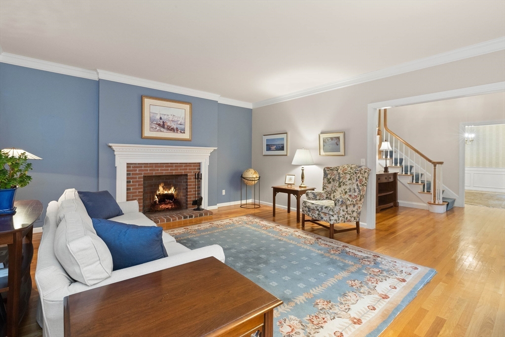 3 Woodland Road Boxford, MA 01921 - Photo 30 of 37 a living room with furniture and a fireplace
