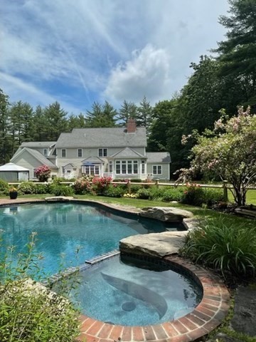 3 Woodland Road Boxford, MA 01921 - Photo 3 of 37 an aerial view of a house with swimming pool and lake view