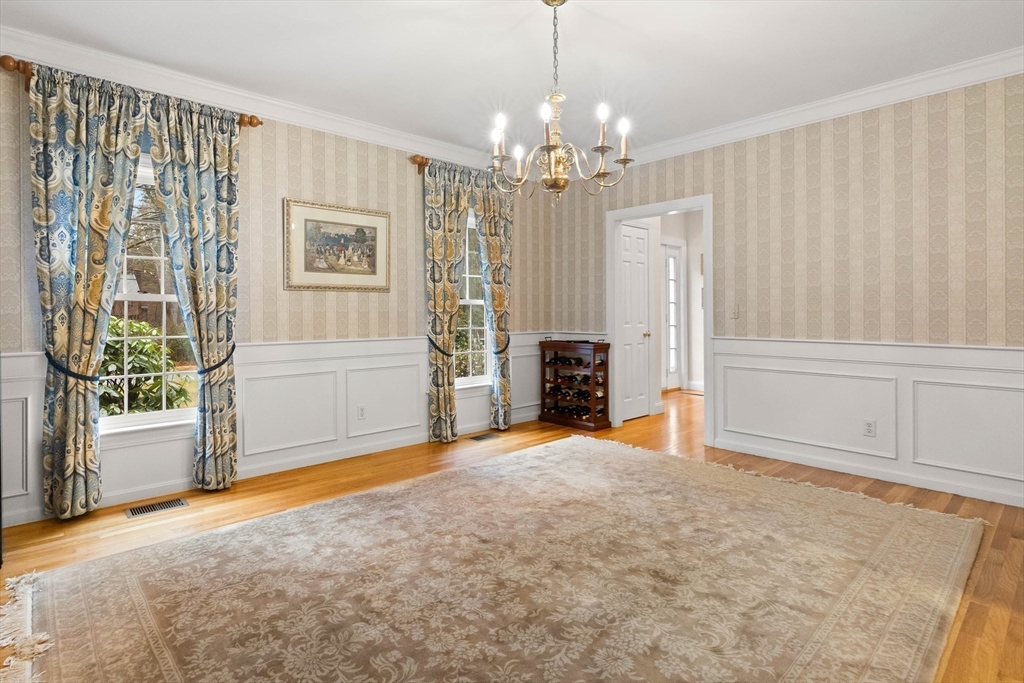 3 Woodland Road Boxford, MA 01921 - Photo 33 of 37 an empty room with fireplace and windows
