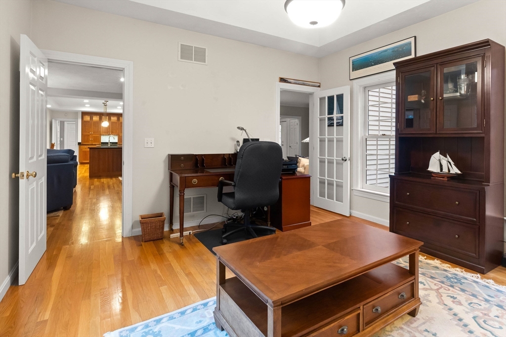 3 Woodland Road Boxford, MA 01921 - Photo 35 of 37 a room with wooden floor and furniture