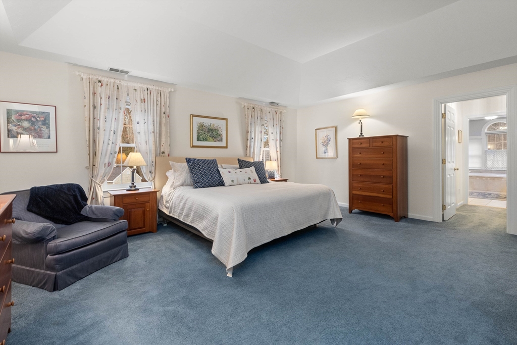 3 Woodland Road Boxford, MA 01921 - Photo 9 of 37 a bedroom with a bed and couch