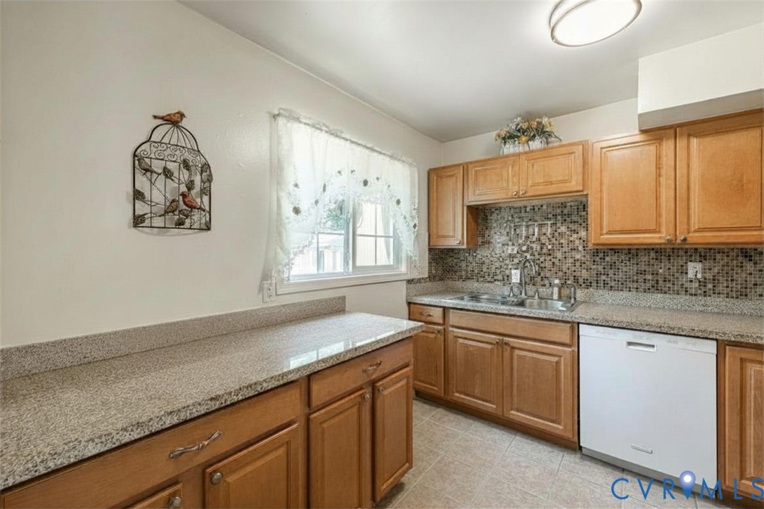 9217 Fisk Road Richmond, VA 23229 - Photo 11 of 39 a kitchen with a sink cabinets and window