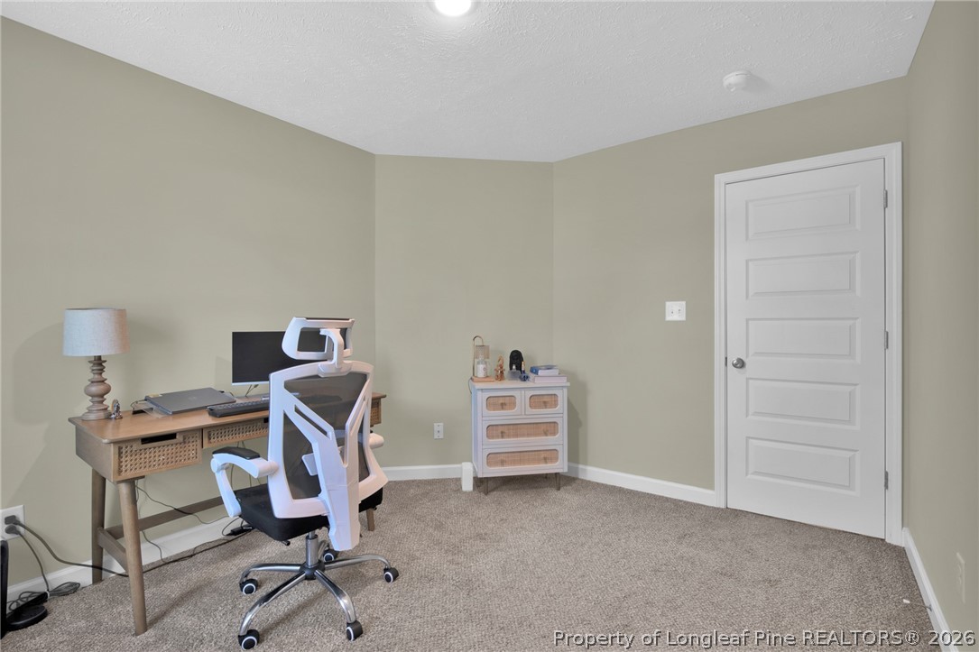 351 Sandy Grove Road Parkton, NC 28371 - Photo 15 of 30 a view of a workspace with furniture