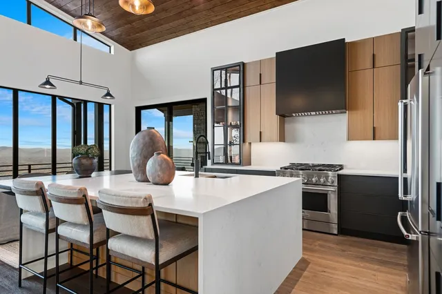 a bathroom with a tub shower and sink