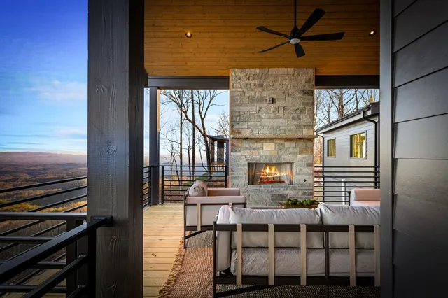 a view of a livingroom with furniture and a flat screen tv