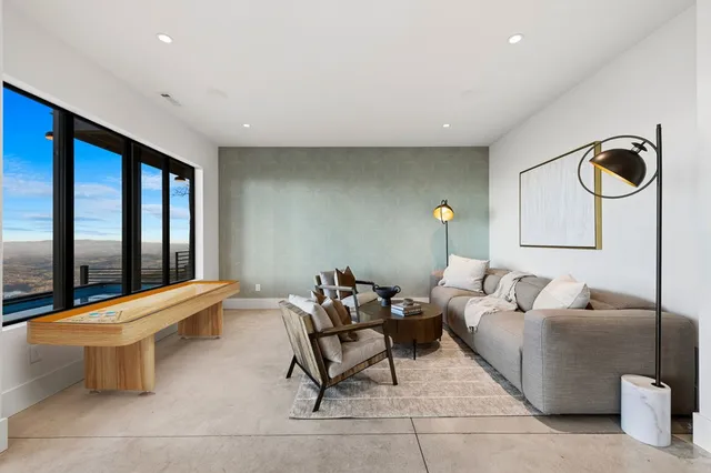 a view of a chairs and table on the wooden floor