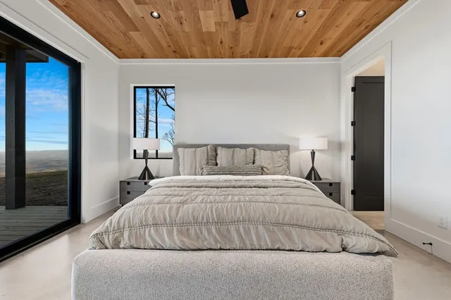 a view of staircase with white walls and a window