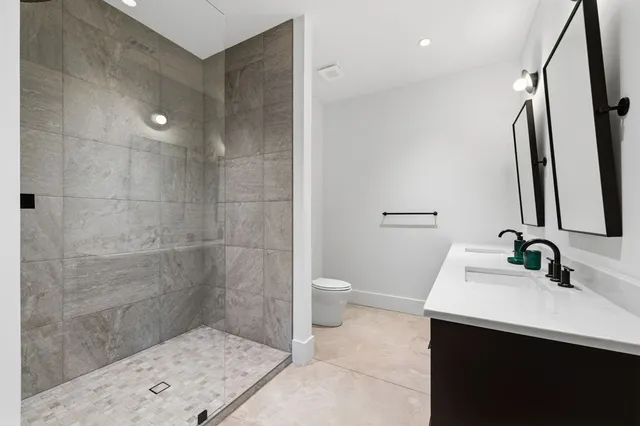 a view of a room with stairs and white walls