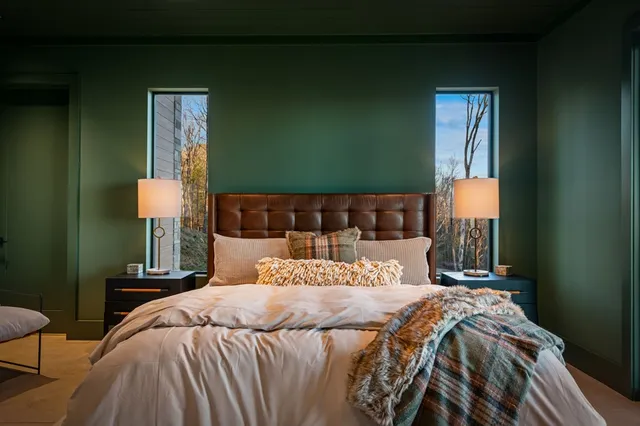 a view of a patio with table and chairs with wooden floor and fence