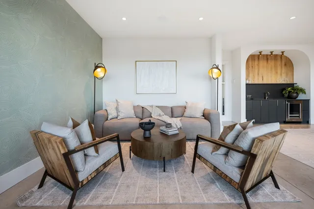 a bedroom with a bed and a lamp