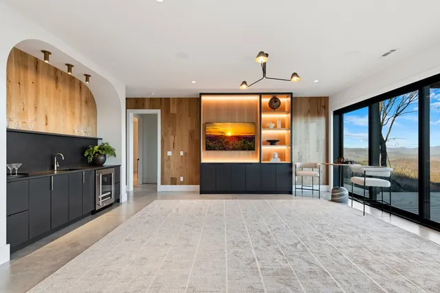 a view of a balcony with two chairs