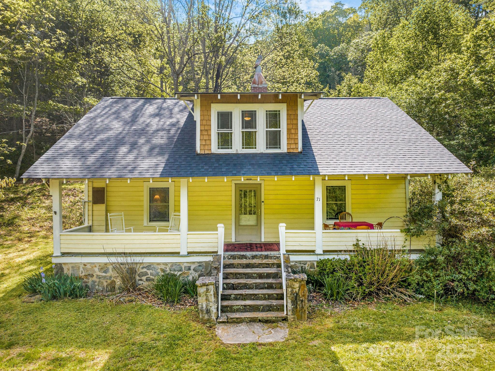 71 Persimmon Lane Canton, NC 28716 - Photo 1 of 25 a front view of a house with a yard