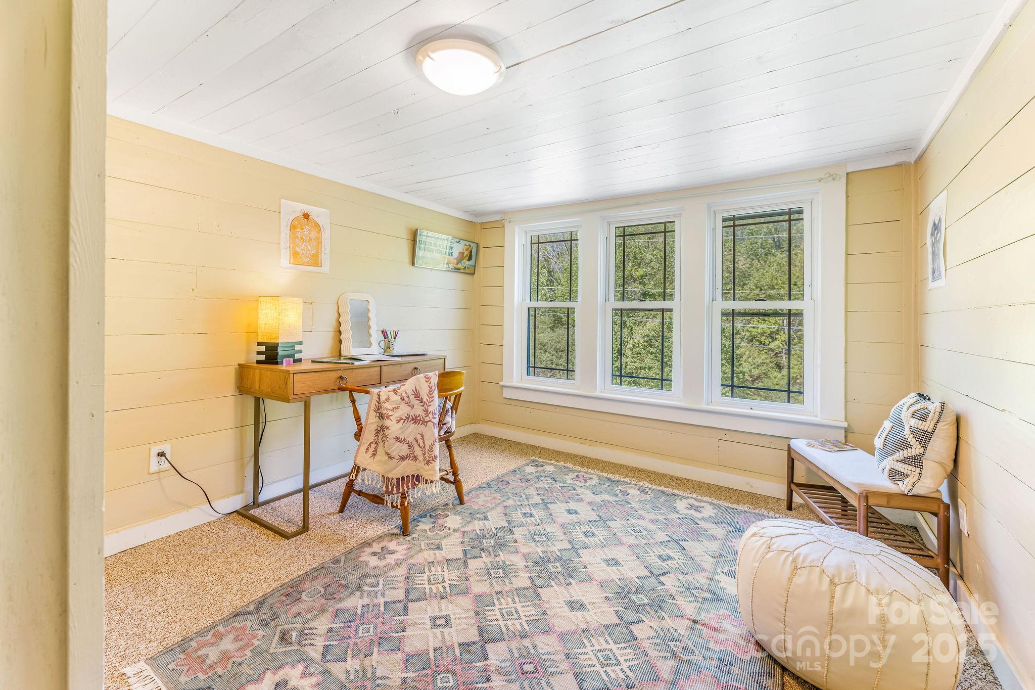 71 Persimmon Lane Canton, NC 28716 - Photo 16 of 25 a living room with a large window and furniture