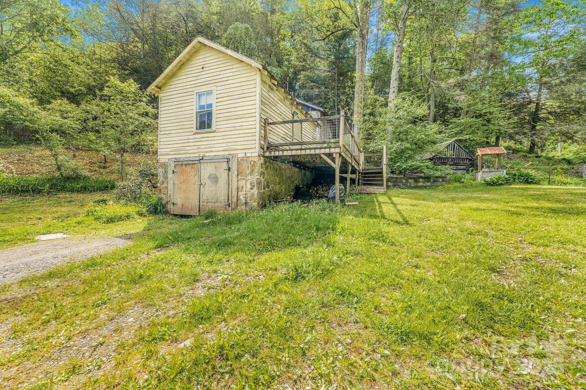 71 Persimmon Lane Canton, NC 28716 - Photo 19 of 25 a view of a house with a yard