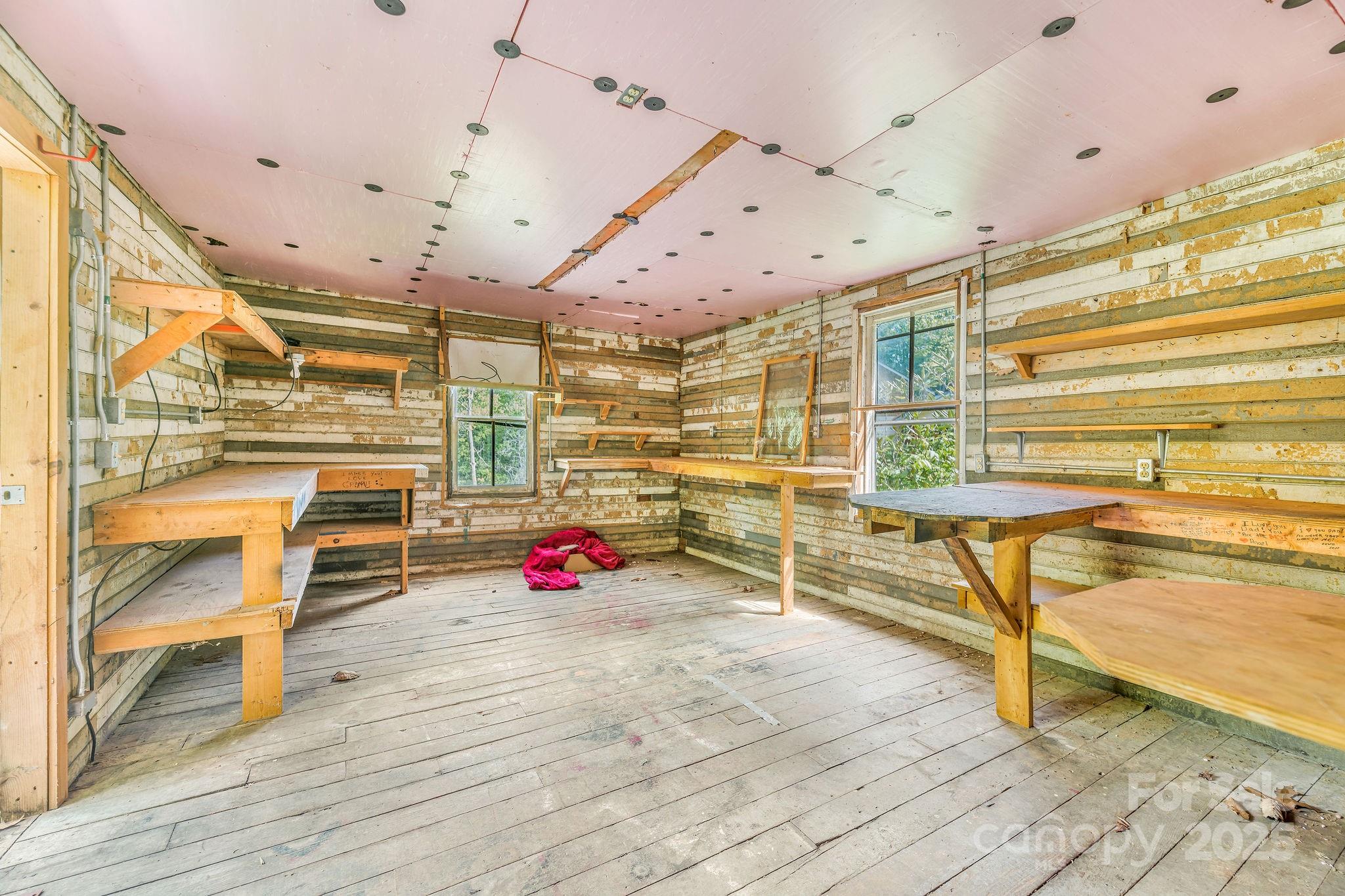 71 Persimmon Lane Canton, NC 28716 - Photo 20 of 25 an empty room with wooden floor and windows