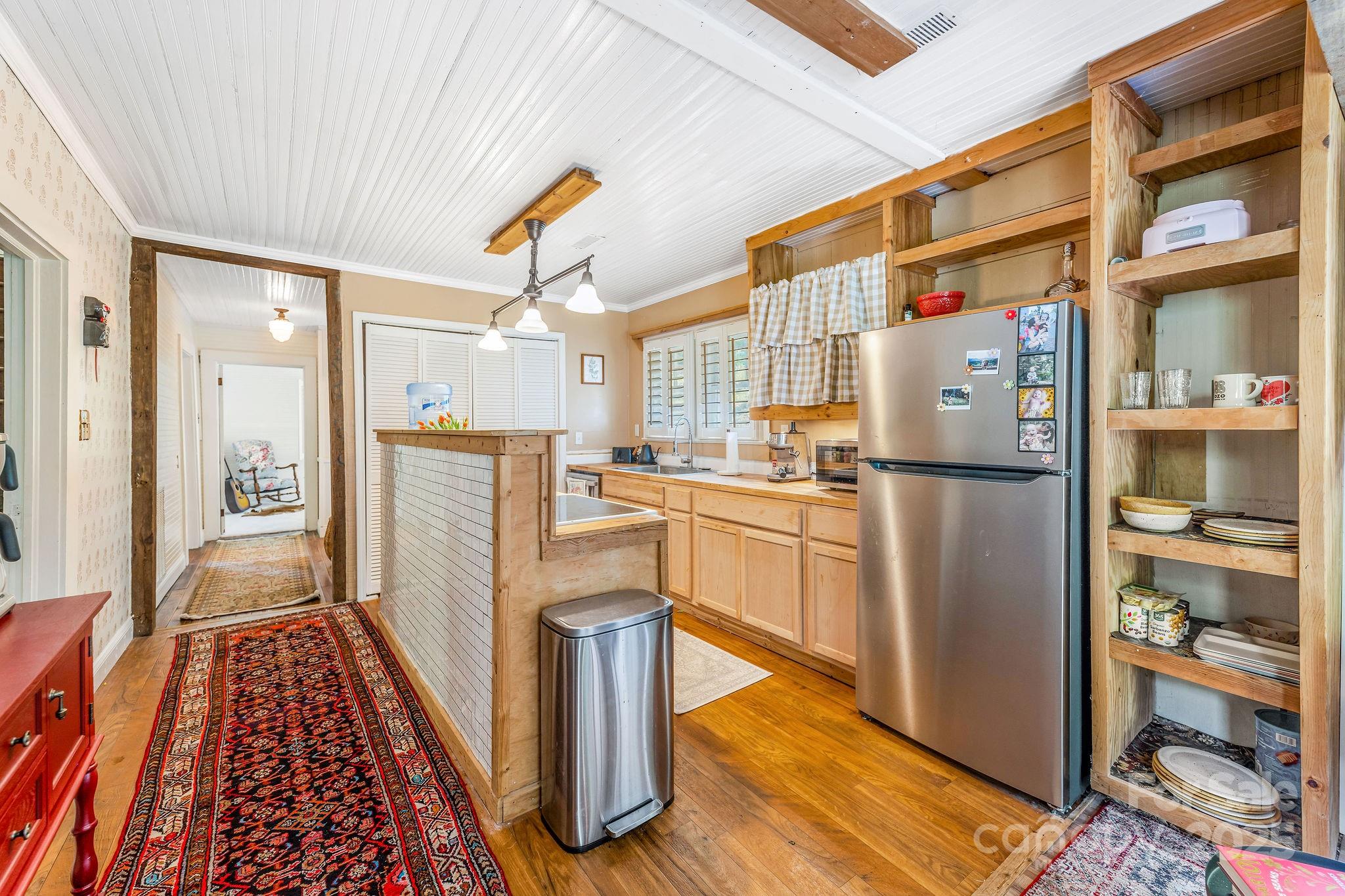 71 Persimmon Lane Canton, NC 28716 - Photo 2 of 25 a kitchen with stainless steel appliances granite countertop a refrigerator and a stove
