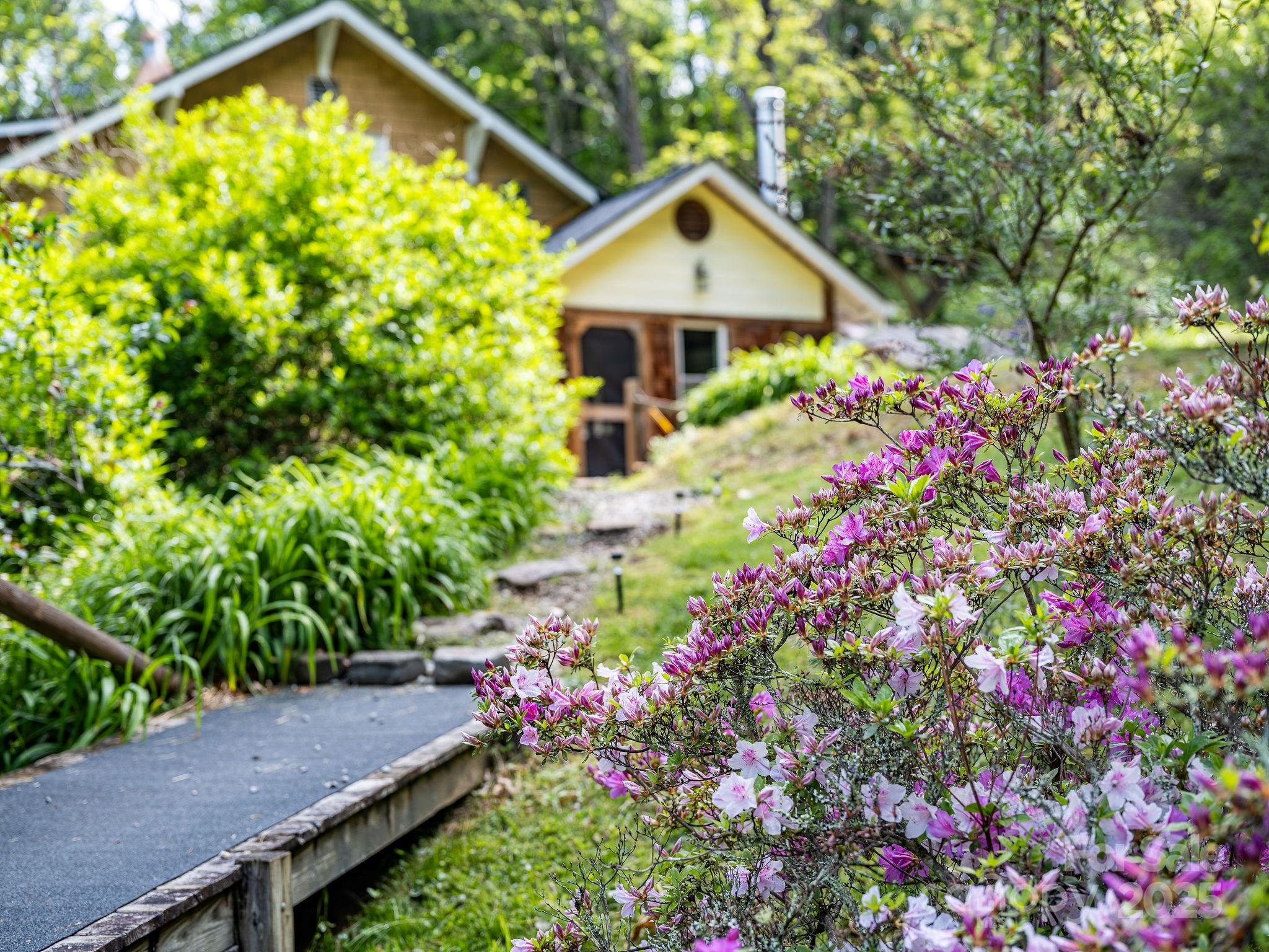 71 Persimmon Lane Canton, NC 28716 - Photo 25 of 25 a front view of a house with a yard and fountain