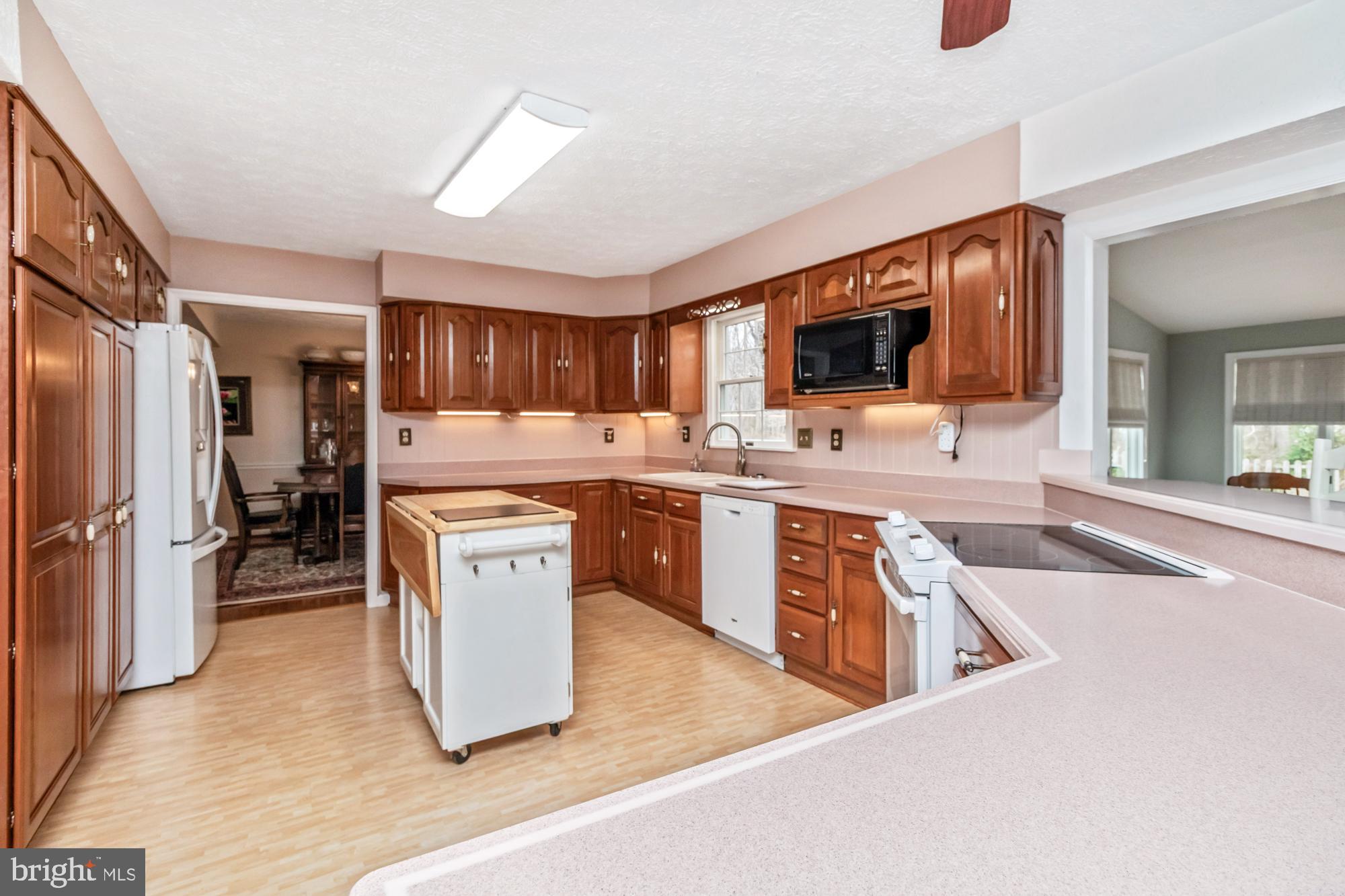 529 Beards Hill Road Aberdeen, MD 21001 - Photo 14 of 65 a kitchen with stainless steel appliances granite countertop a stove a sink a refrigerator and a microwave