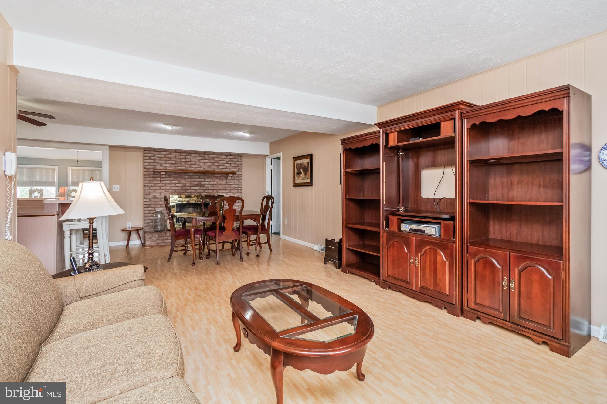 529 Beards Hill Road Aberdeen, MD 21001 - Photo 18 of 65 a living room with furniture a dining table and chairs