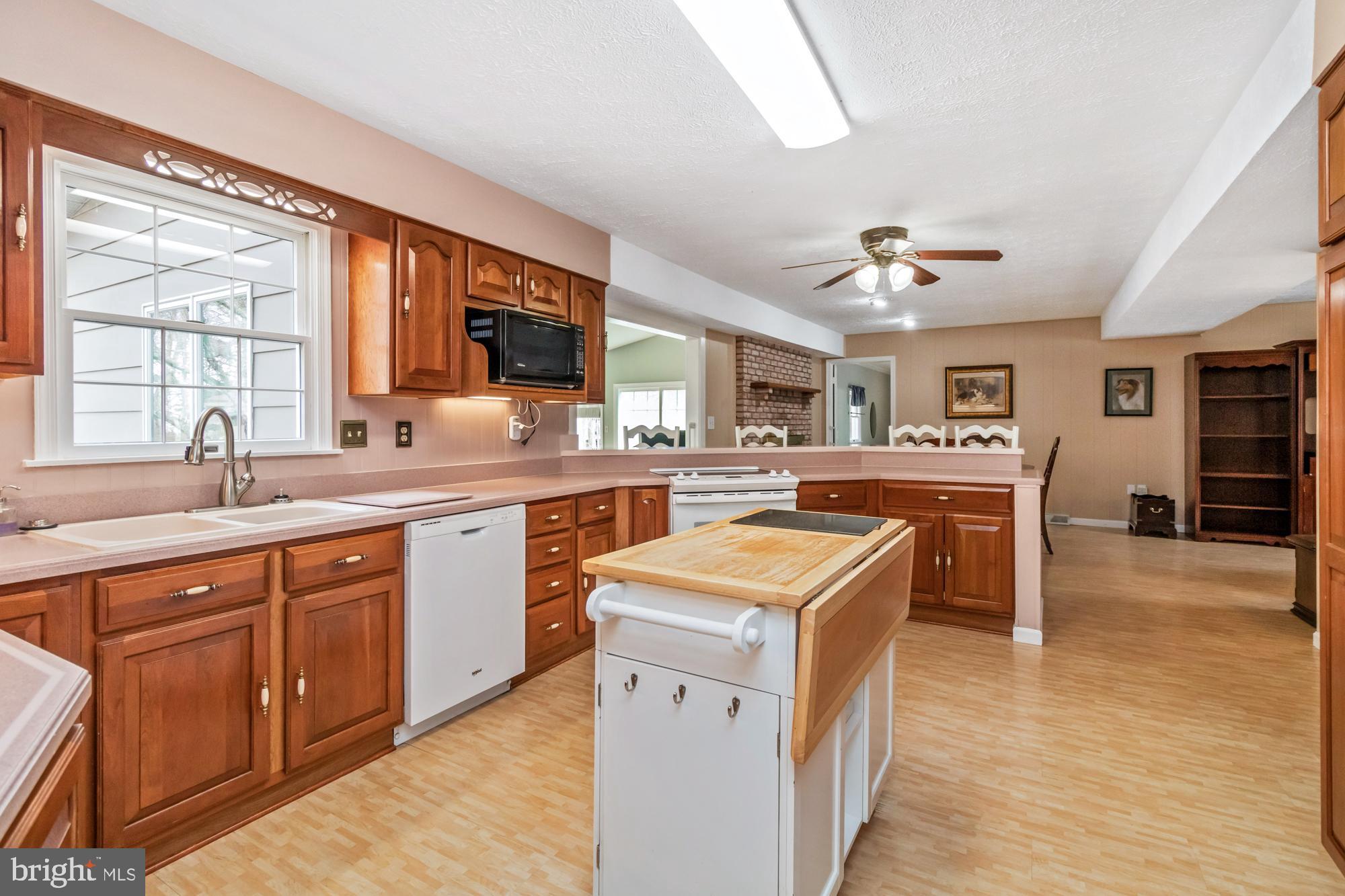 529 Beards Hill Road Aberdeen, MD 21001 - Photo 22 of 65 a kitchen with a sink stove and cabinets